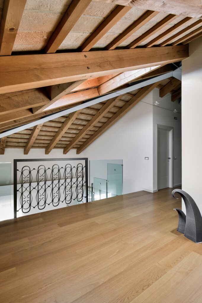 Interiors of a Modern Living Room in the Attic With Wood Floor