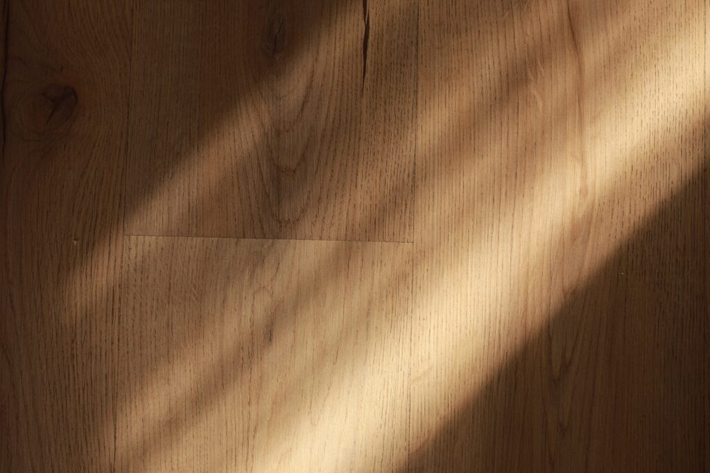 Laminate background. Wooden laminate and parquet boards for the floor in interior design with sun
