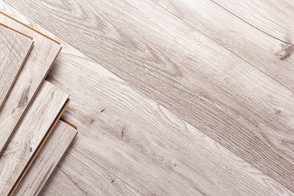 Laminate wood floor background texture. Grey wooden laminate