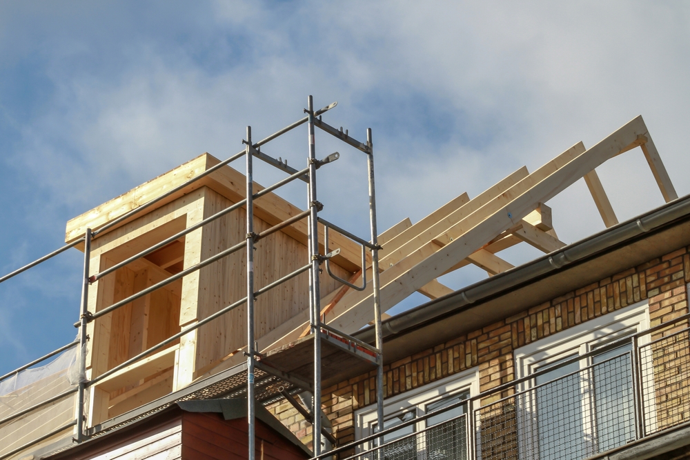 Dormer,Installation,On,The,Rooftop,Of,A,Apartment,House
